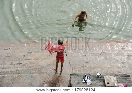Hindu Pilgrims Take A Holy Bath In The River Ganges