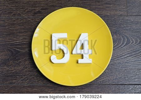 Figure fifty-four at the plate yellow and brown background.