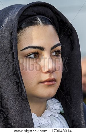 CAGLIARI, ITALY - May 1, 2014: 358 Religious Procession of Sant'Efisio - portrait of a beautiful girl in traditional Sardinian costume - Sardinia