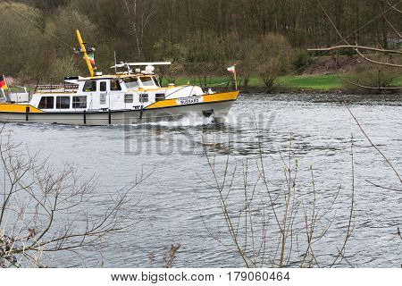 ESSEN NRW GERMANY - APRIL 4 2016: River supervisor boat Bussard MS at a check ride on the river Ruhr in Germany. Boat in use for water protection.