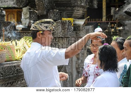 People Praying At Tirta Empul Hindu Temple Of Bali On Indonesia