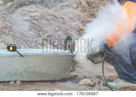The mechanic is using concrete mortar. Cause dustiness while cutting And on the concrete pillars there are cartridges mounted on concrete pillars.