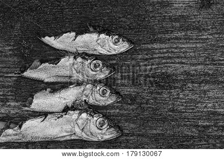 Pieces of herrings on a wooden board