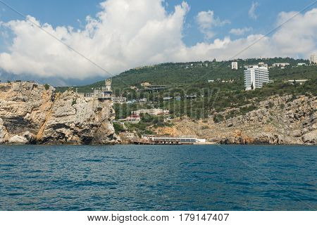 The village of Gaspra at the Black sea with the symbol of Crimea - swallow's nest castle on the Aurora cliff of Cape AI-Todor. Crimea Russia
