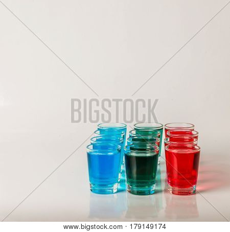 Glasses With Blue, Green And Red Kamikaze, Glamorous Drinks, Mixed Drink Poured Into Shot Glasses
