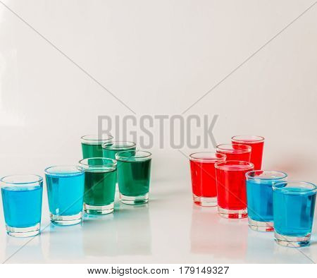 Glasses With Blue, Green And Red Kamikaze, Glamorous Drinks, Mixed Drink Poured Into Shot Glasses