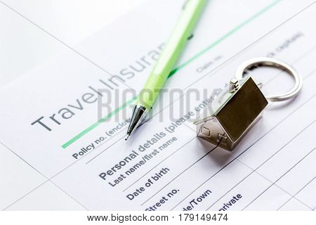 Traveling concept with insurance application form on white table background