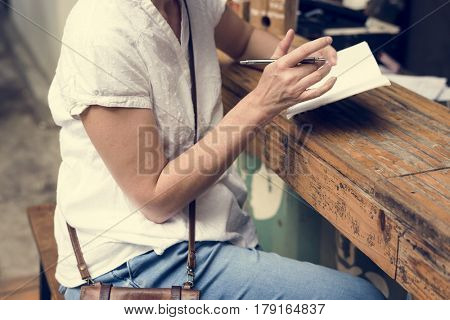 Woman holiday lifestyle writing dairy relax at cafe