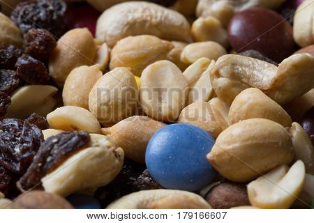 Close Up Of Pile Of Trail Mix With Nuts, Raisins, And Candy