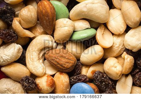 Close Up Of Pile Of Trail Mix With Nuts, Raisins, And Candy