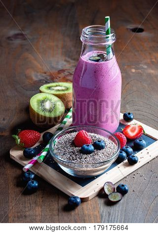 Berry smoothie with yogourt summer detox drink clean eating vegetarian vegan superfood and healthy diet concept selective focus toned image