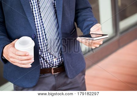 Successful Young Asian Man In Business Casual Attire In Relaxing Outdoor With Cup Of Coffee Looking