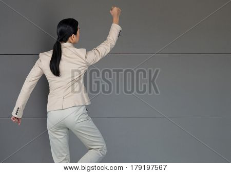 Digital composite of Business superhero against wood background