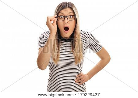 Baffled young woman with eyeglasses looking at the camera isolated on white background