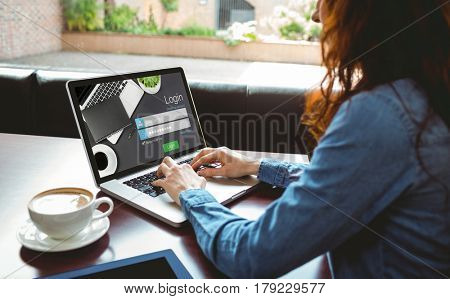 Close-up of login page against mature student using laptop in cafe