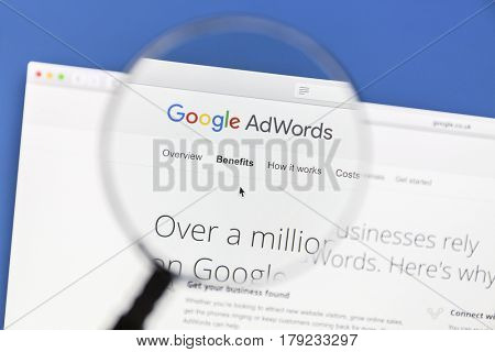 Ostersund, Sweden - Mars 29, 2016: Google Adwords website under a magnifying glass. Google AdWords is an online advertising service.