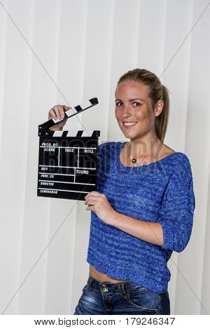 woman with clapperboard