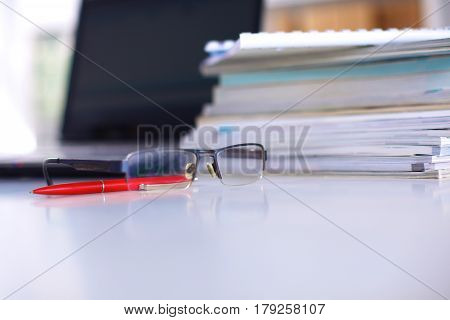 Group Of Multicolored Office Folders And Glasses