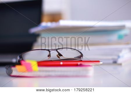 Group Of Multicolored Office Folders And Glasses