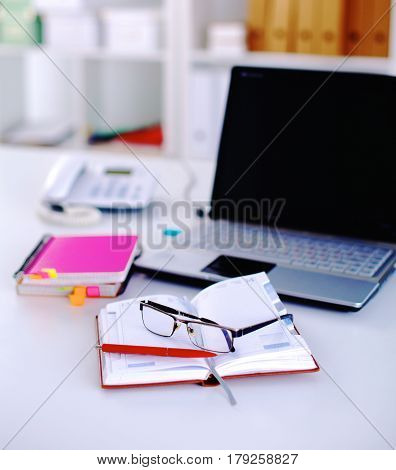 Group Of Multicolored Office Folders And Glasses