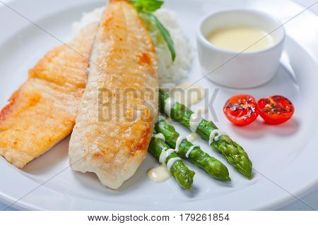 Delicious Fish Steak With Green Asparagus And Rice