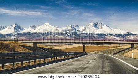 Empty highway D1 and snowy peaks of High Tatras mountains Slovakia