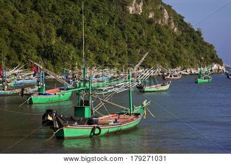 Blue boat in the sand on the beach in Pranburi Thailand