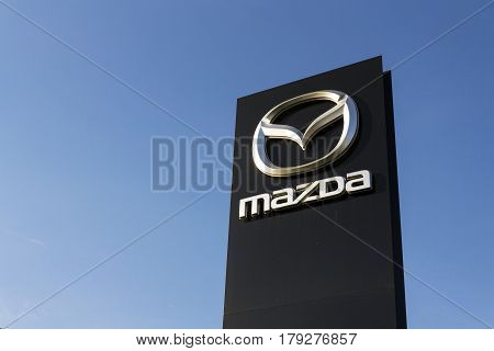 Prague, Czech Republic - March 31: Mazda Car Company Logo In Front Of Dealership Building On March 3