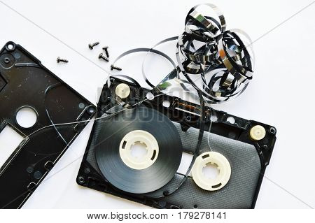 audio cassette tape dismantling parts on white background