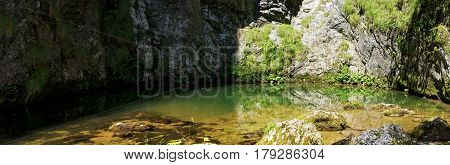 Izbucul Tauzului, karst spring in Apuseni mountains, Romania
