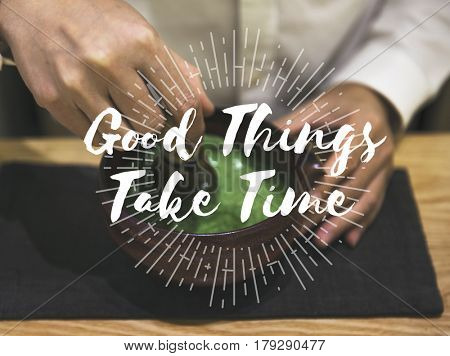 Hands with Japanese Green Tea and Good things Take Time Quote