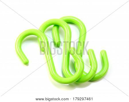 green s-shape hooks isolated on white background