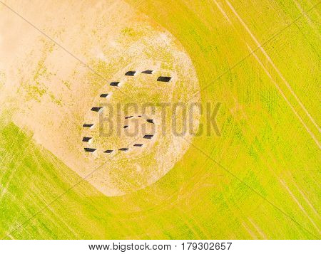 Aerial view of ancient esoteric geomancy symbol in green wheat field. Mystery of Czech countryside. Spring landscape near Pilsen. Czech Republic, Central Europe.