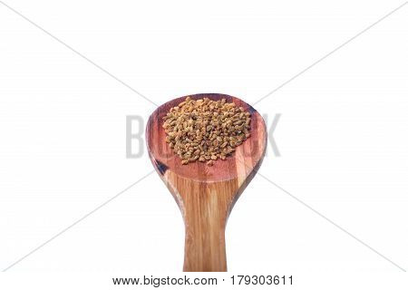 Fenugreek Seeds On A Brass Spoon Isolated On A White Background.