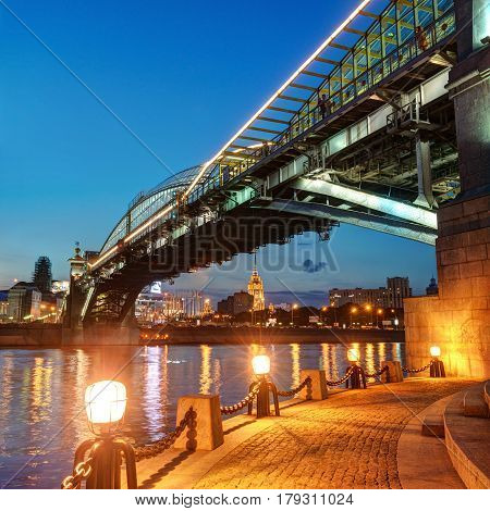 MOSCOW - AUGUST 20, 2013: Bogdan Khmelnitsky bridge at night. It is a beautiful pedestrian bridge across the Moscow River near Kievsky railway station.