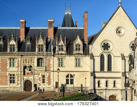 BLOIS, FRANCE - SEPTEMBER 22, 2013: The chateau Royal de Blois: the facade of the Louis XII wing. This old palace is located in the Loire Valley, in the center of the city of Blois, France.