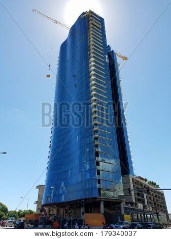 HONOLULU HI - JULY 30: Luxury condo waiea - 1118 ala moana under construction in Kakaako Hawaii. The Condo will features 171 RESIDENCES OF EXCEPTIONAL SCALE AND LUXURY VILLAS WITH PRIVATE GARAGES PRIVATE GARDENS AND SWIMMING POOLS OR SKY LANAIS and SPECTA