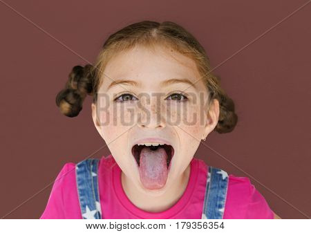 Little Girl Smiling Happiness Sticking Out Tongue Studio Portrait