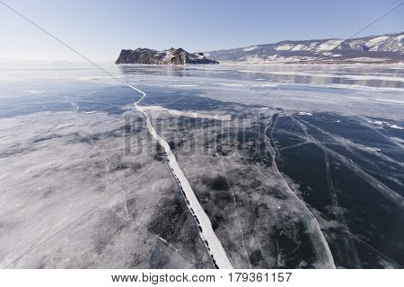 Cracks In Ice. Lake Baikal, Oltrek Island. Winter Landscape