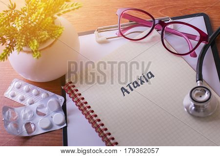 Stethoscope On Note Book With Ataxia Words As Medical Concept.