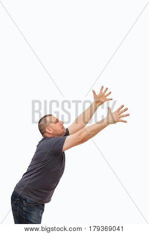 The man creates an image of the request and entreaty by gestures and a mimicry on the isolated background.