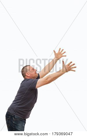 The man creates an image of the request and entreaty by gestures and a mimicry on the isolated background.