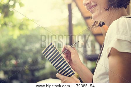 Woman holiday lifestyle writing dairy relax