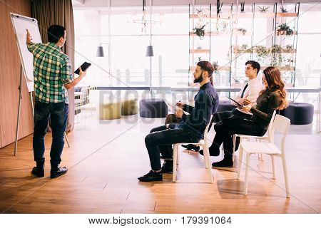 Tech Start-up Business Team Discussing Product Roadmap For Product And Investment In Office