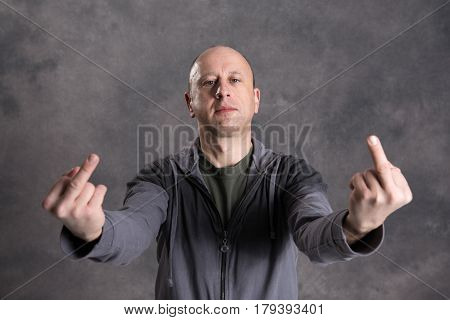 Baldheaded Man Showing Middle Finger