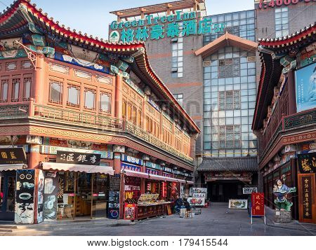 Tianjin, China - Nov 1, 2016: Stores along the famous Tianjin Ancient Cultural Street, with traditional and modern design elements. Morning scene to what is a very popular tourist area.