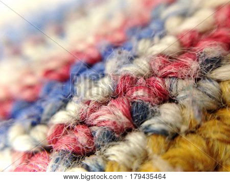 Colored yarn knitted art. Background in macro