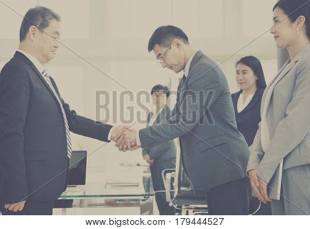 Business Partners Introductionary Handshake Bow