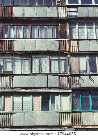 Old building with color bright windows in rural area