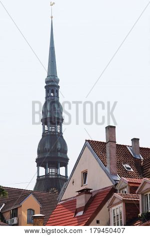 View on Bell tower of St. Peter cathedral in Vecriga and old houses Riga Latvia